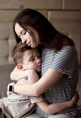 Mom hugs her son. photo