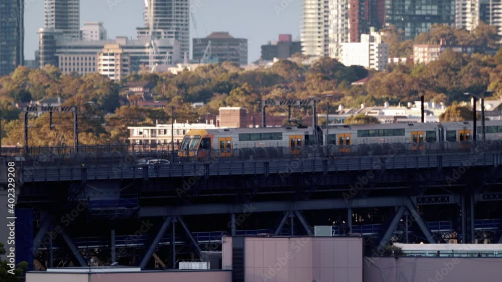 Train And Car Running On Sydney Harbour Bridge In New South Wales, Australia - tracking shot, slow motion Train And Car Running On Sydney Harbour Bridge In New South Wales, Australia - tracking shot, slow motion