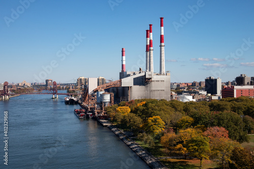 Long Island City Queens Autumn Skyline with Colorful Trees and a Power Plant along the East River in New York City