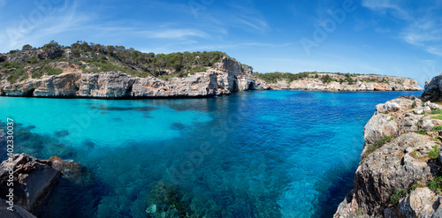 Panoramic view of the beautiful beach "Caló des Moro" immersed in the Mediterranean scrub with stunning reef and crystal clear water, Majorca (Mallorca) Balearic Islands, Spain, Europe.