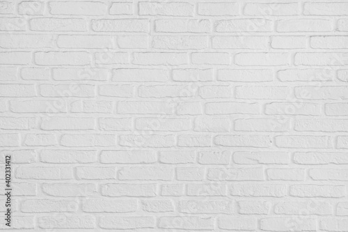 On a white painted brick wall background