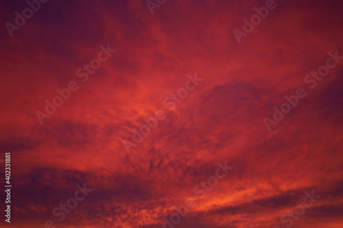 red clouds in the first rays of the rising sun