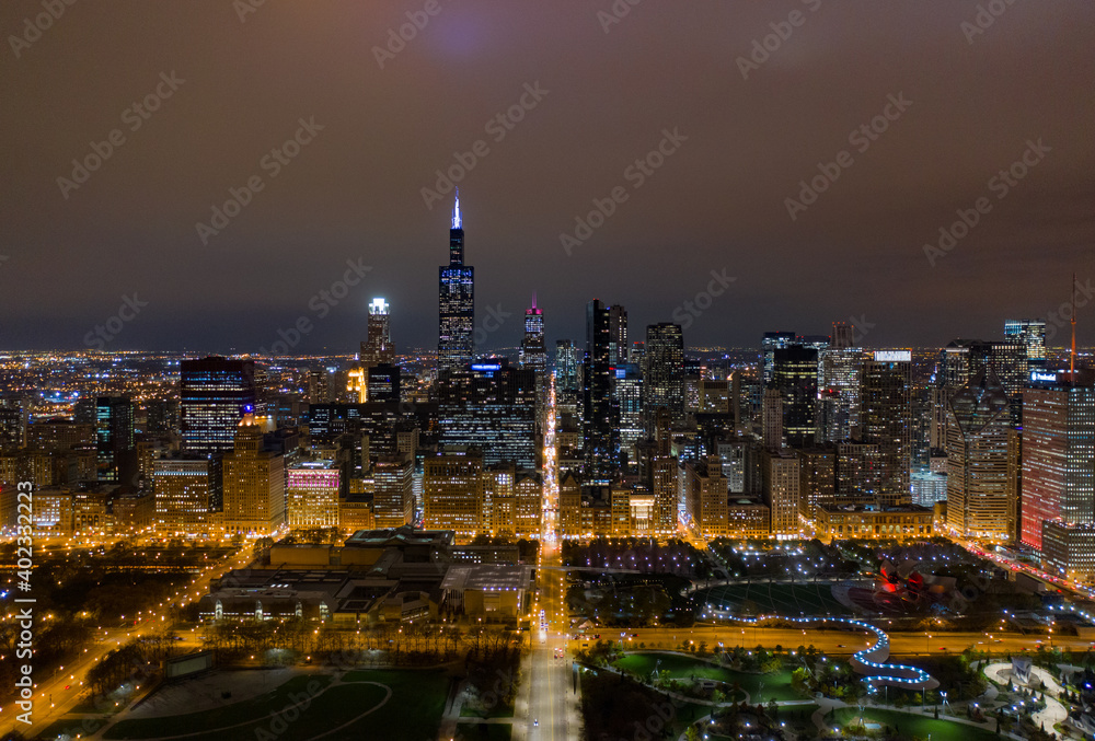 epic aerial drone shot of cityscape panorama at night time