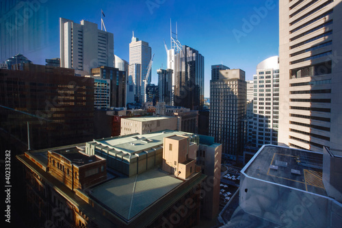 Photography view of the buildings and skyscrapers of the Sydney business district lit by the Sun, Sydney city Australia