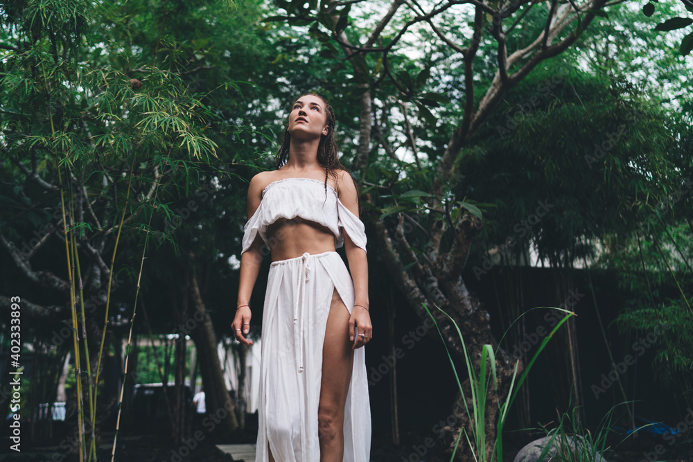 Sensual woman standing in garden Sensual woman standing in garden