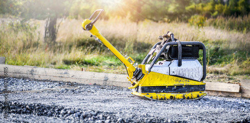 Vibration plate heavy machine compactor for construction compacting or beating sand.