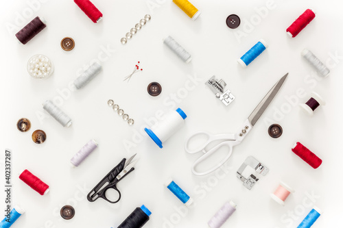 Sewing accessories and sewing supplies. Spools of thread, scissors and centimeter
