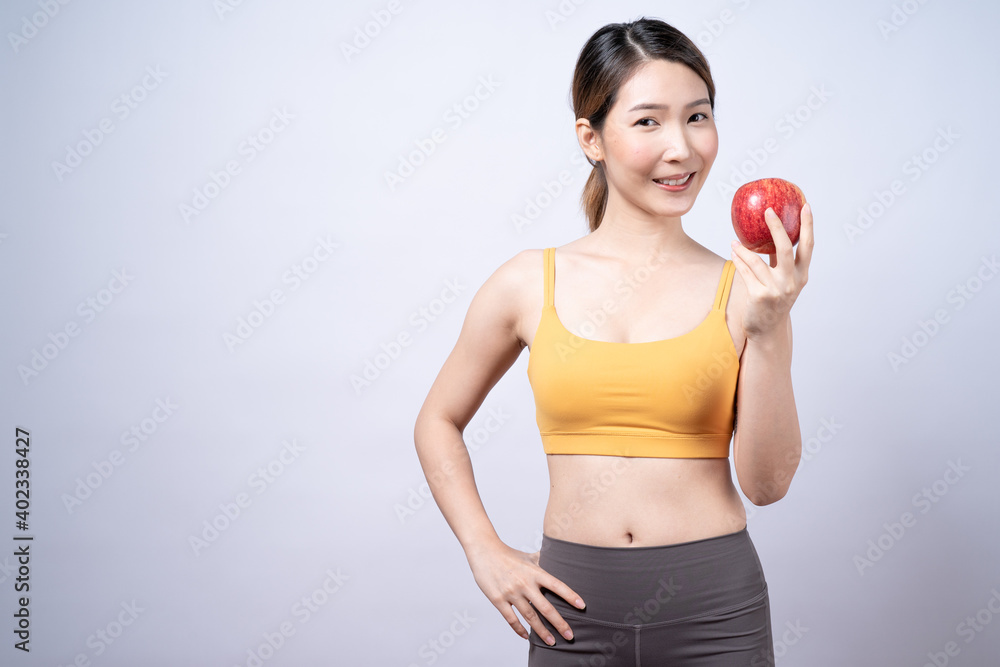 Smiling Asian woman holding red apple Isolated on white background. Smiling Asian woman holding red apple Isolated on white background.