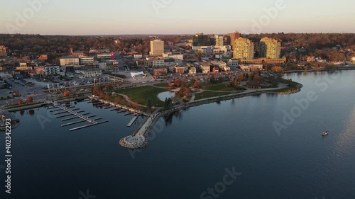 City of Barrie waterfront and downtown aerial drone dolly shot with Lake Simcoe marina, condo buildings, banks, parks and infrastructure. Clear fall day. photo