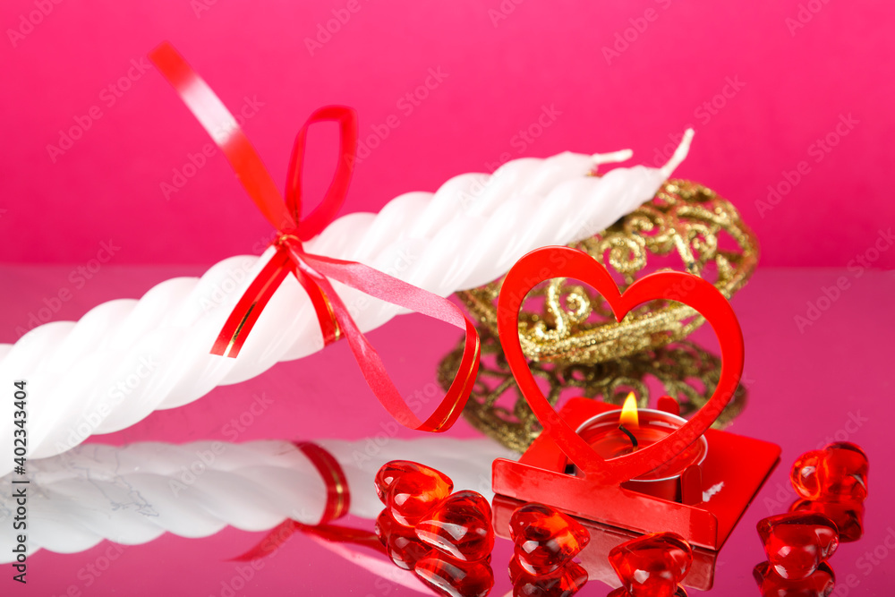 Valentine's Day souvenirs candles and a heart-shaped candlestick.