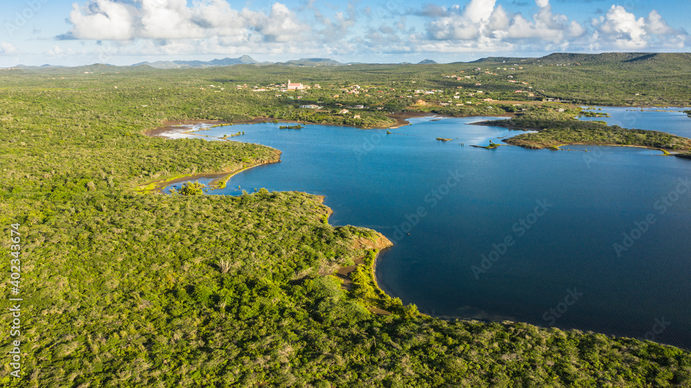 Aerial view above scenery of Curacao, Caribbean with ocean, coast, hills Aerial view above scenery of Curacao, Caribbean with ocean, coast, hills