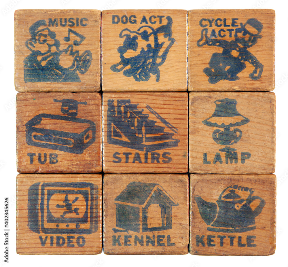 Worn and tattered vintage toy vocabulary word blocks.