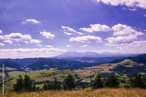 Fototapeta Naklejka Na Ścianę i Meble -  Bielsko Biala, South Poland: Wide angle view of Polish mountains from south in summer against dramatic clouds. Beskidy mountains in Silesia near slovakia border.