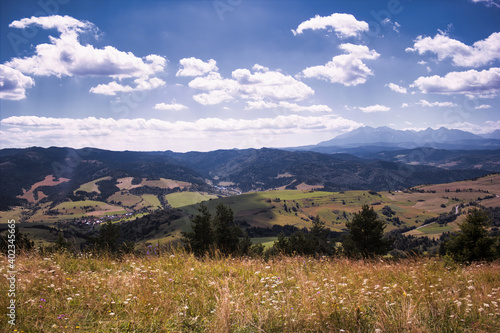 Fototapeta Naklejka Na Ścianę i Meble -  Bielsko Biala, South Poland: Wide angle view of Polish mountains from south in summer against dramatic clouds. Beskidy mountains near slovakia border.