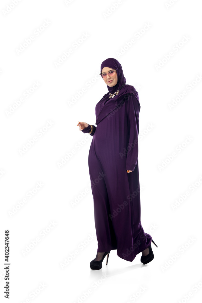 Serious. Beautiful arab woman posing in stylish hijab on studio background with copyspace for ad. Fashion, beauty, style concept. Female model with trendy make up, manicure and accessories.
