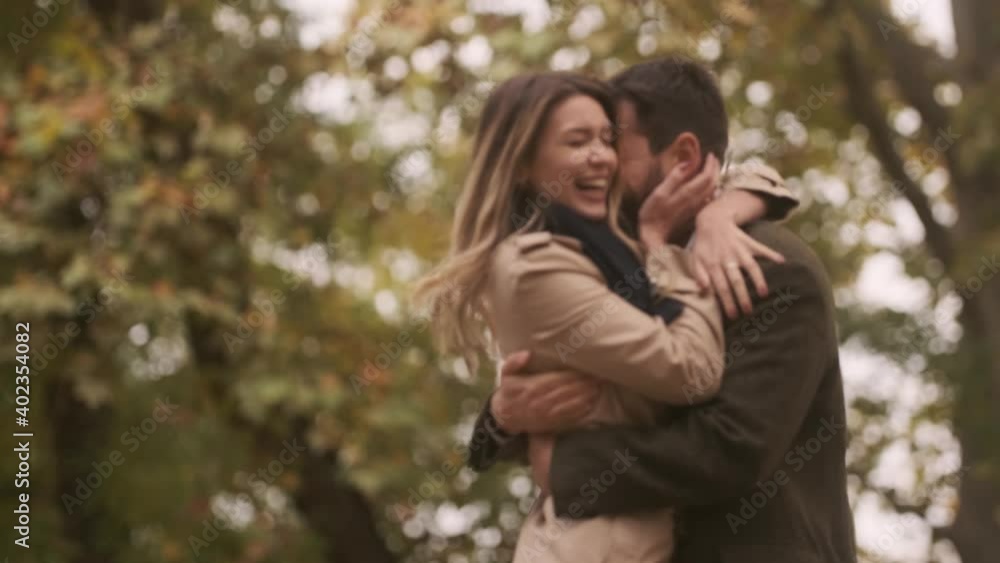 Handsome young couple walking in the autumn park Handsome young couple walking in the autumn park