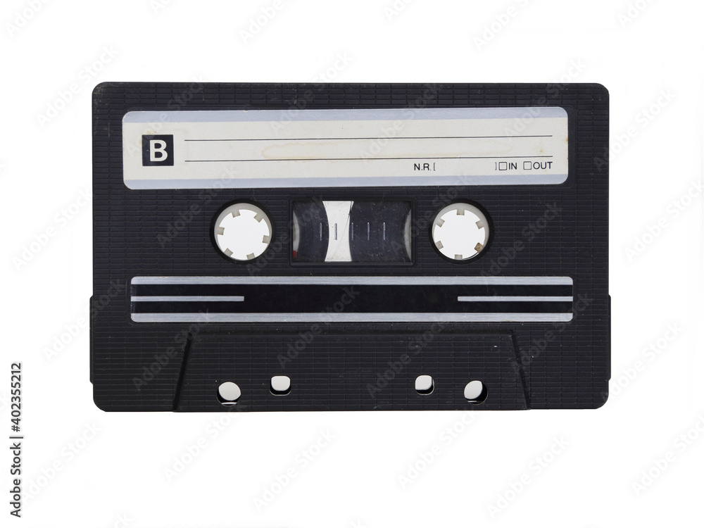Fototapeta premium An unmarked, black analog cassette tape is shown on its B side, in a closeup view and isolated against a white background.