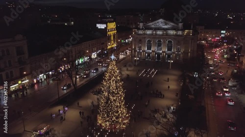 Wallpaper Mural Arial view of Christmas tree in city Lviv, Ukraine square near Opera House, December 2020. New year 2021 with colored lights in Fair market. Old town at winter night. Santa Claus celebration holidays Torontodigital.ca