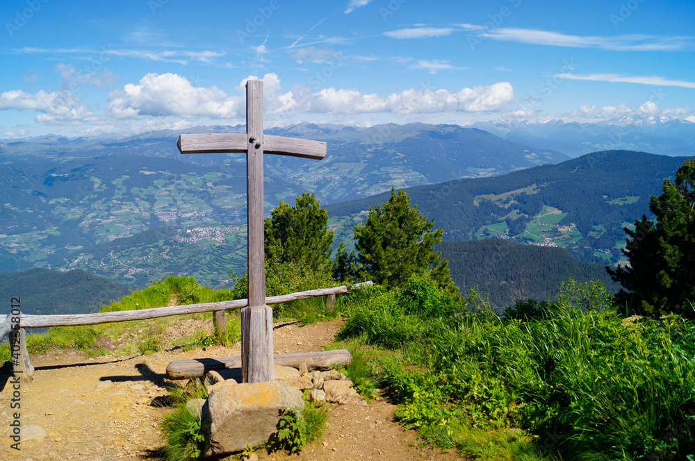 The Goller Cross in front of the fantastic alpine panorama at Alpe di Siusi, Italy. The Goller Cross in front of the fantastic alpine panorama at Alpe di Siusi, Italy.