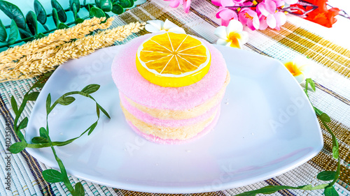 Cirebon - December 31, 2020 - Traditional Snack from Indonesia as known Rambut Nenek or Arbanat, is a snack made from sugar served with lemon slices photo