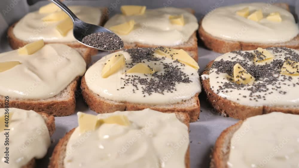 Spreading some chia seeds on the toasted bread.close-up.4K UHD Spreading some chia seeds on the toasted bread.close-up.4K UHD