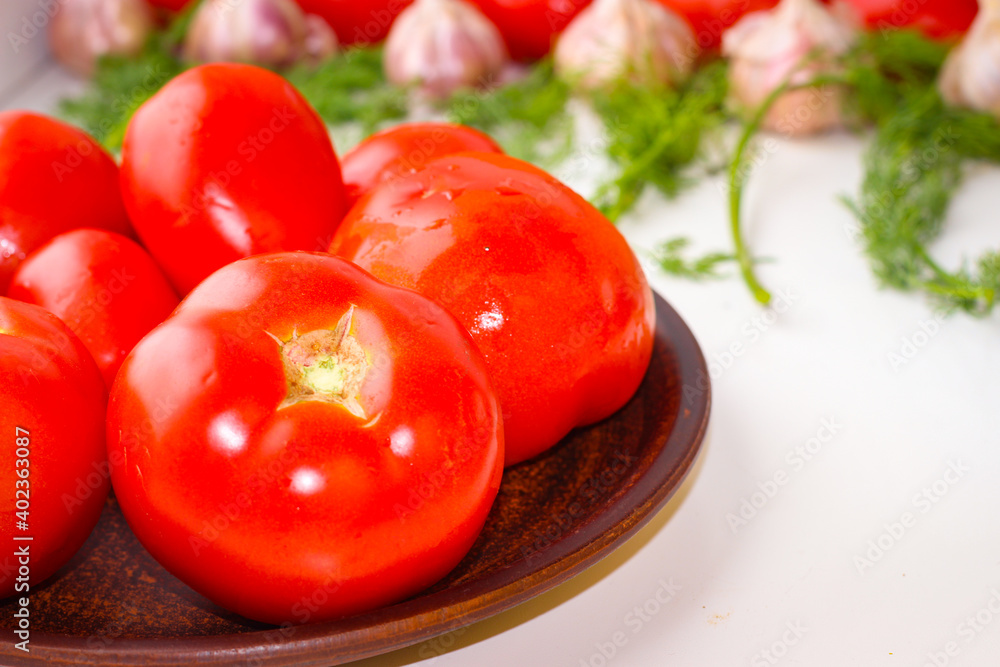 Good organic cucumbers and red tomatoes and garlic Good organic cucumbers and red tomatoes and garlic