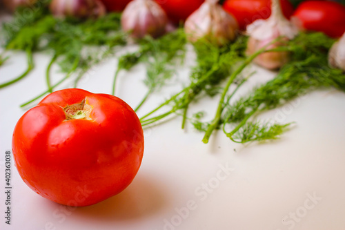 Good organic cucumbers and red tomatoes and garlic