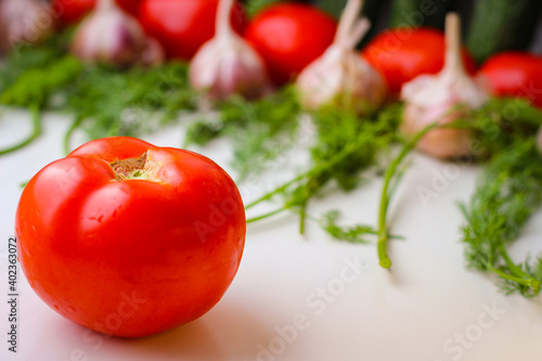 Good organic cucumbers and red tomatoes and garlic
