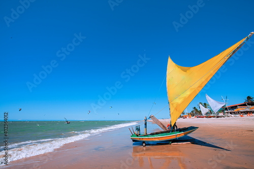 Raft or Jangada, typical sail boat from Brazil Northeast, used for fishing and, actually, for tourism transportation. Cumbuco Beach, Ceara, Brazil. photo