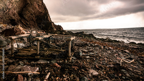 A washed up lobster cage on the shore in the east coast of Canada.