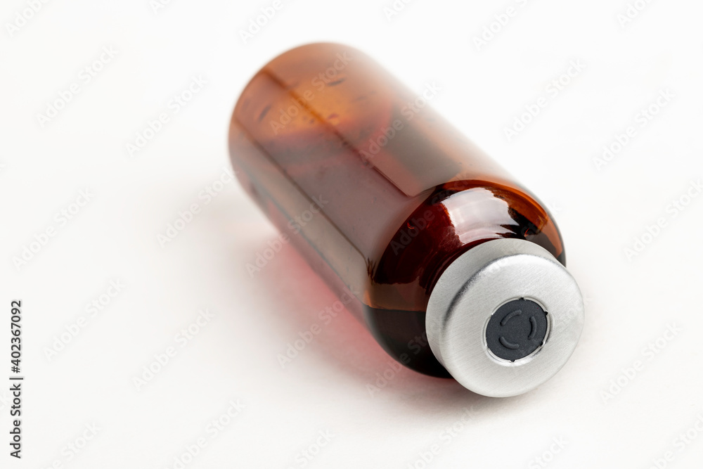 Macro Image Of Amber Vaccine Vial In White Background Macro Image Of Amber Vaccine Vial In White Background