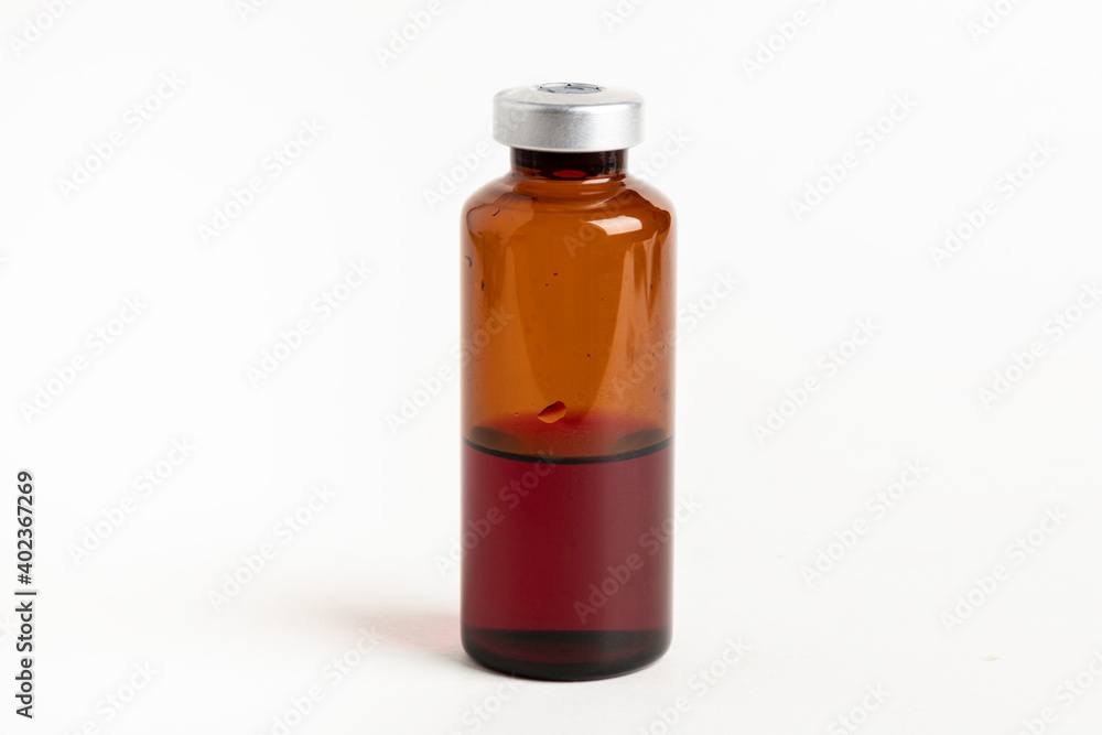 Macro Image Of Amber Vaccine Vial In White Background Macro Image Of Amber Vaccine Vial In White Background