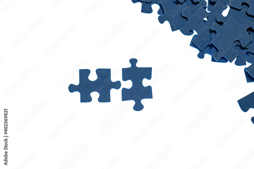 small blue puzzle pieces on a white background, add a picture from small pieces, a useful exercise for the brain, training attention and patience small blue puzzle pieces on a white background, add a picture from small pieces, a useful exercise for the brain, training attention and patience