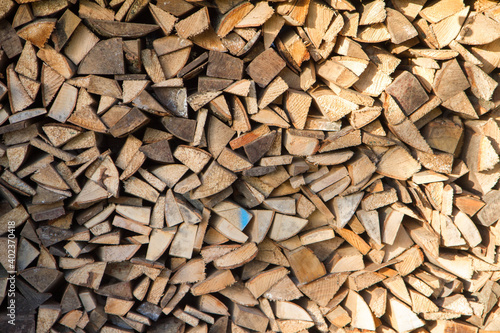 Pile of chopped fire wood prepared for winter   © teine