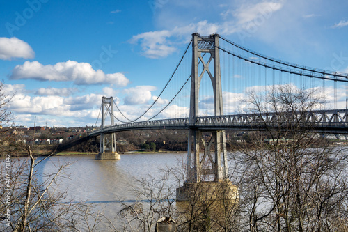 Poughkeepsie, NY - USA -Dec. 29, 2020: The Franklin Delano Roosevelt Mid-Hudson Bridge is a toll suspension bridge across the Hudson River between Poughkeepsie and Highland in the state of New York. photo