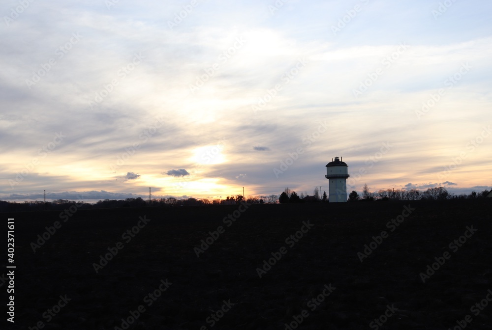 View of the sunset behind the old water reservoir tower.