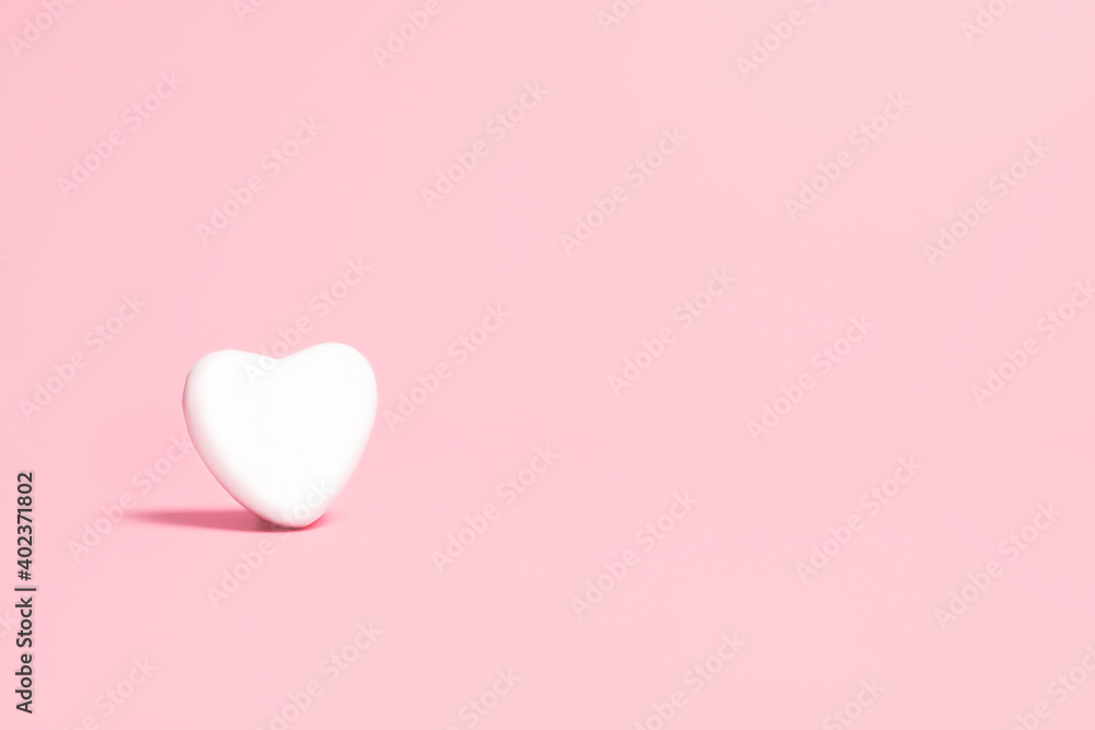 White heart on a pink background. Valentine's day concept.