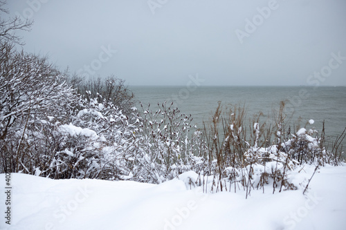 Snow covered Edgewater Beach Park, Ohio, with view on lake Erie, Ohio, USA, during winter and Christmas season.  photo