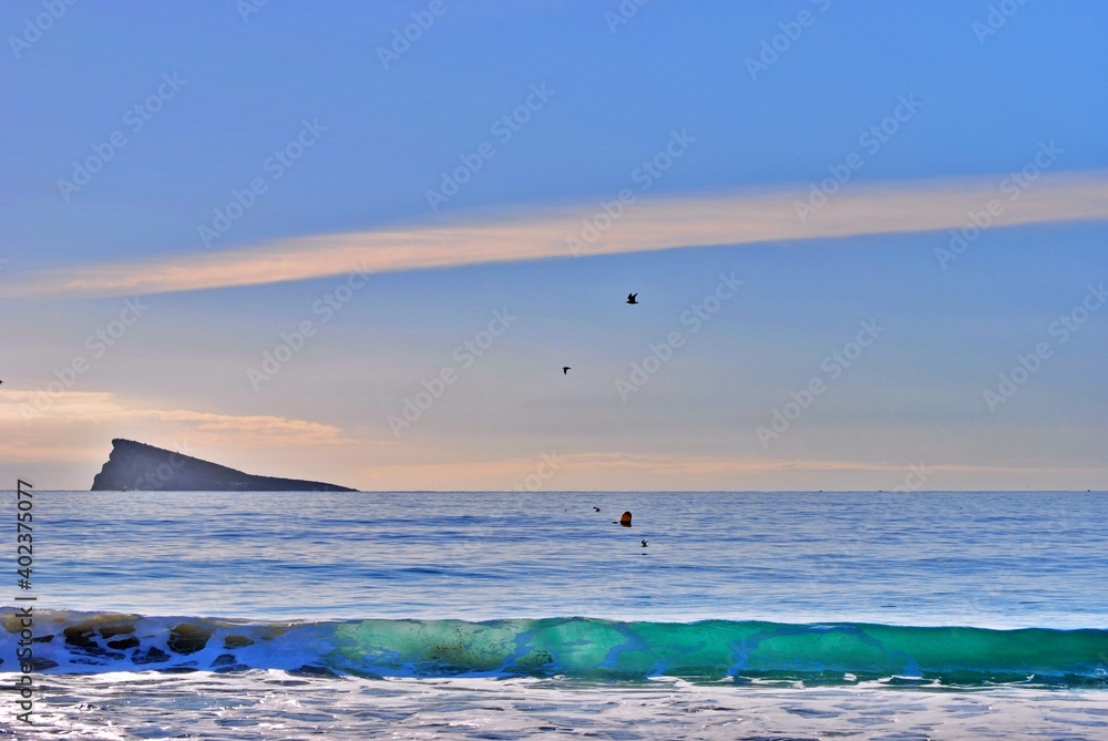 
Beach plan with islet on the horizon