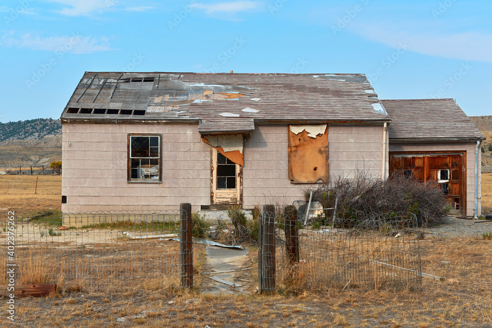 Front of an abandoned farmhouse on the plains of Wyoming, USA Front of an abandoned farmhouse on the plains of Wyoming, USA