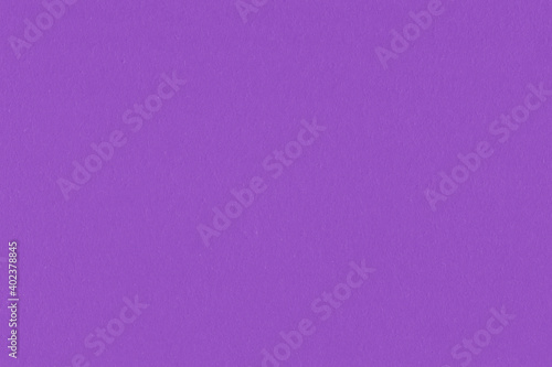 Clean purple retro paper background. Vintage violet cardboard texture. Grunge paper for drawing. Simple blank fabric pattern. © artistmef