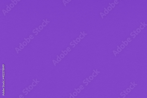 Clean purple retro paper background. Vintage violet cardboard texture. Grunge paper for drawing. Simple blank fabric pattern.