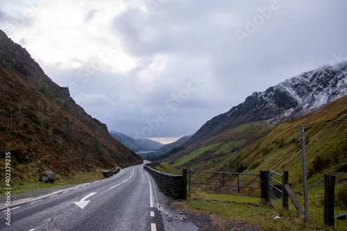 the view down the Mach loop next to Cadair Idris with snow covered mountains on either side photo