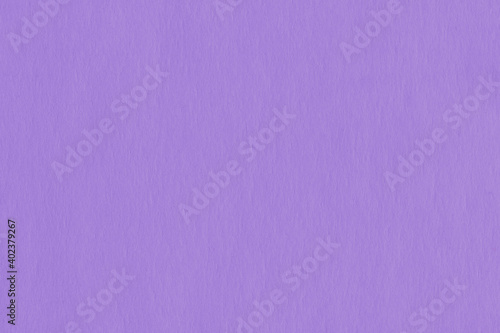 Clean purple retro paper background. Vintage violet cardboard texture. Grunge paper for drawing. Simple blank fabric pattern.