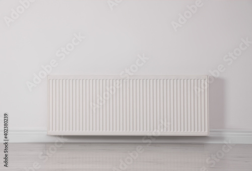 Wallpaper Mural Modern radiator on white wall. Central heating system Torontodigital.ca