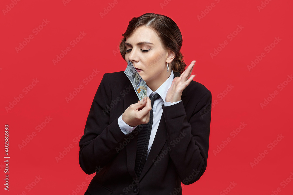 Attractive girl in retro style sniffs 100 dollar bill Attractive girl in retro style sniffs 100 dollar bill