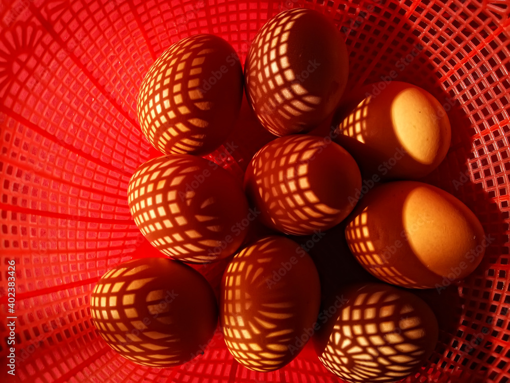 close up of eggs in the red basket