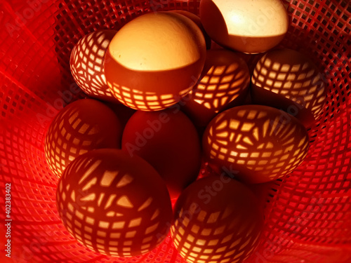 close up of eggs in the red basket