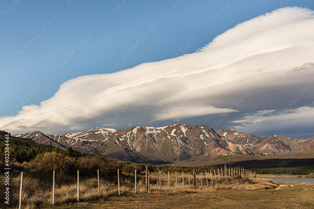 Landscape view of lenticular clouds over the lake during afternoon in Esquel, Patagonia, Argentina
