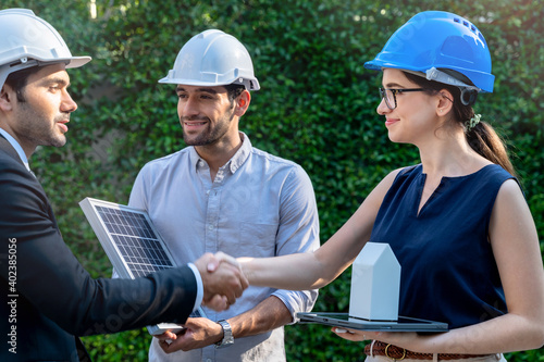 Business Engineers Meeting Innovative More Efficient Solar Panel Battery Concept of Renewable Energy Working. Specialists Gathered for Outdoor testing Photovoltaic cells module. photo